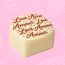 Wholesale Nirvana Bulk case of white chocolates with red "amour"stencil with crunchy praline filling (approx 60) 2.2 lb- Bulk